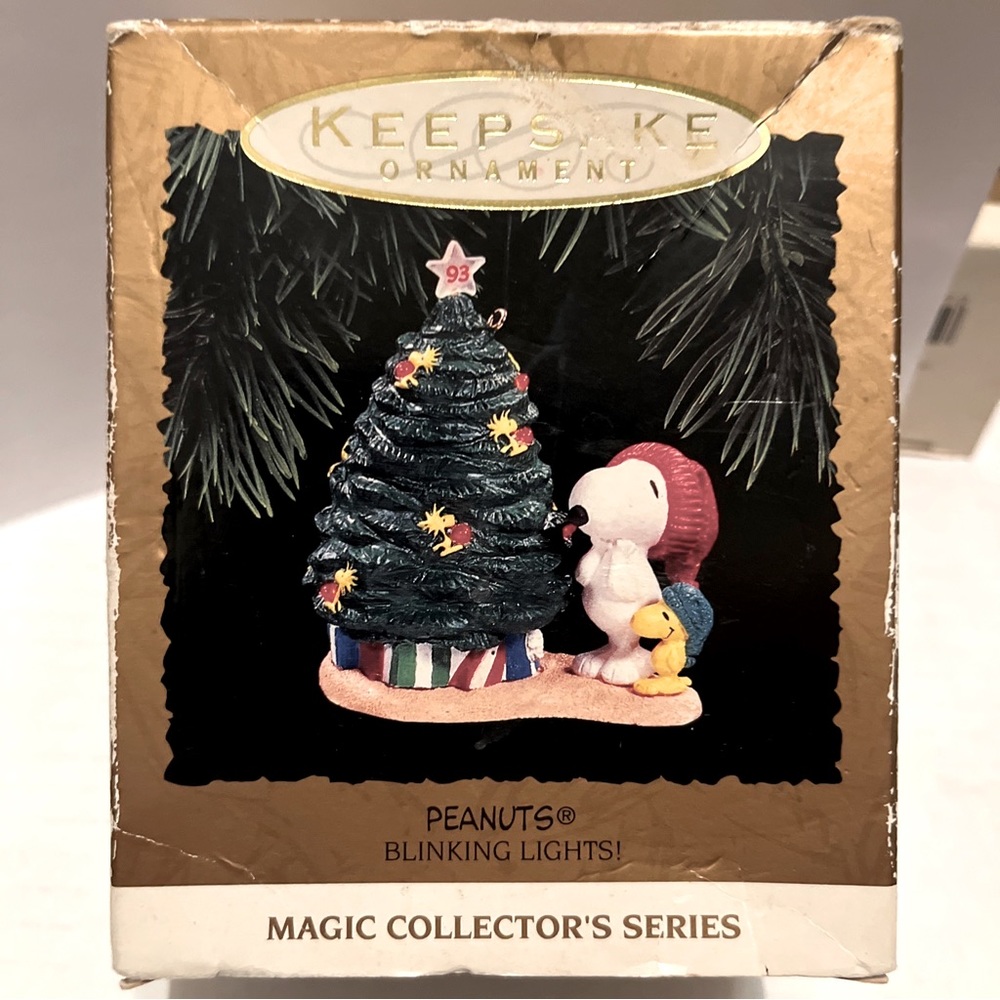 Snoopy Christmas ornament by Hallmark that lights up. New in box